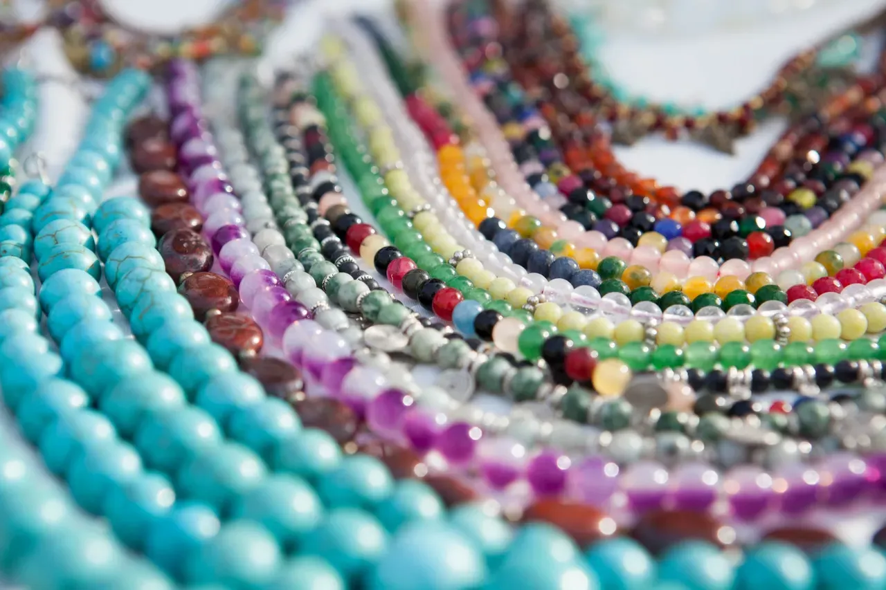 Vibrant gemstone necklaces in rows