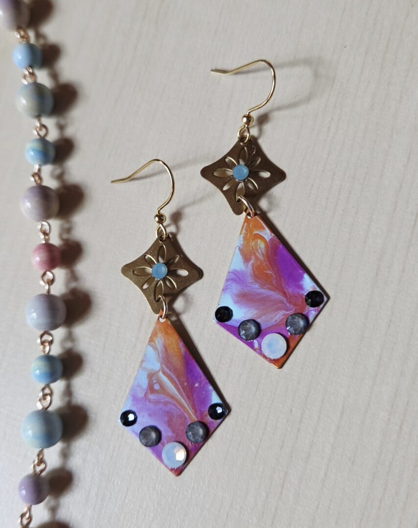 Hand painted brass dangle earrings with Monet inspired watercolor patina, Swarovski crystals, and gold filled ear wires.