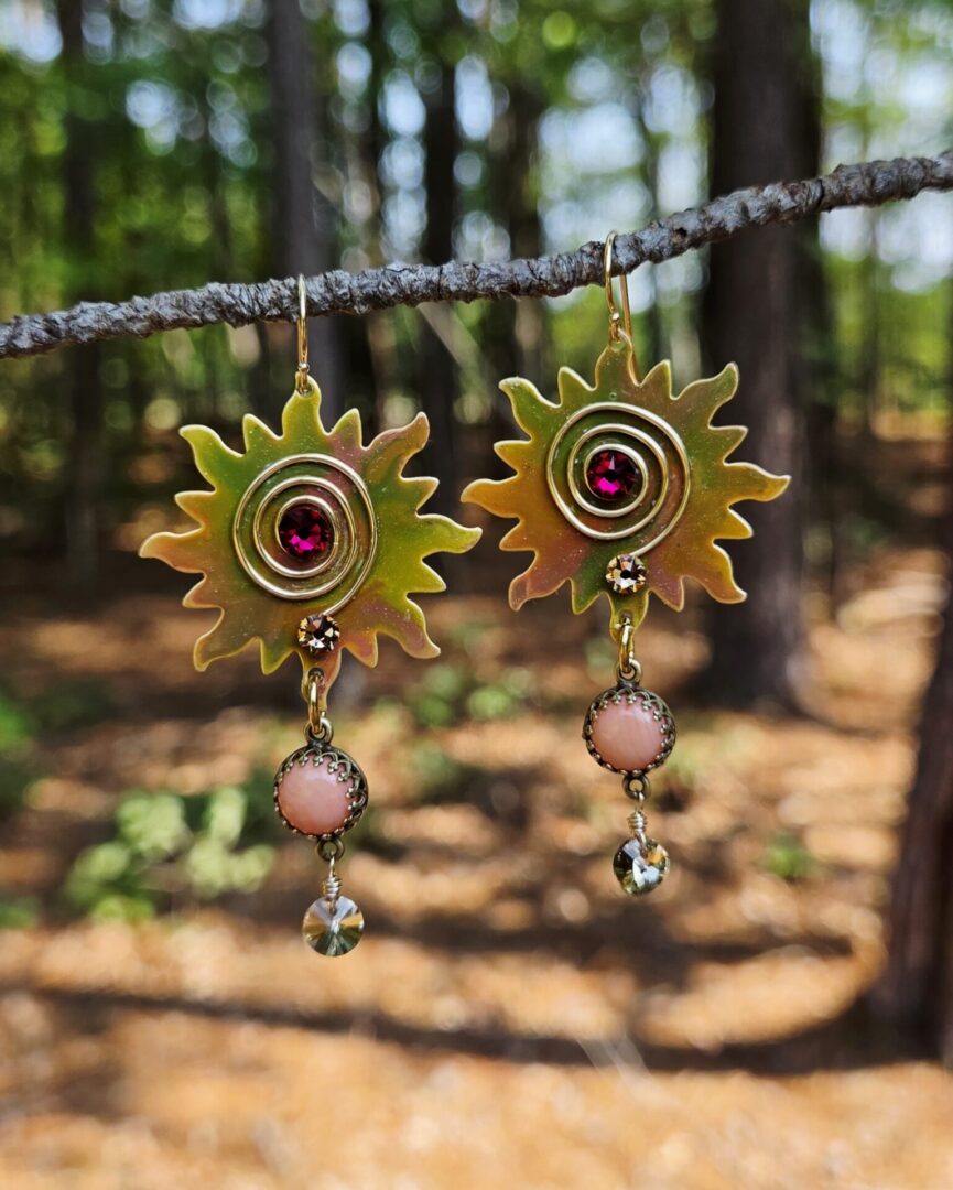 Hand painted Monet inspired sun earrings with genuine coral cabochons, handmade gold wire scrolls, and Swarovski crystal accents.