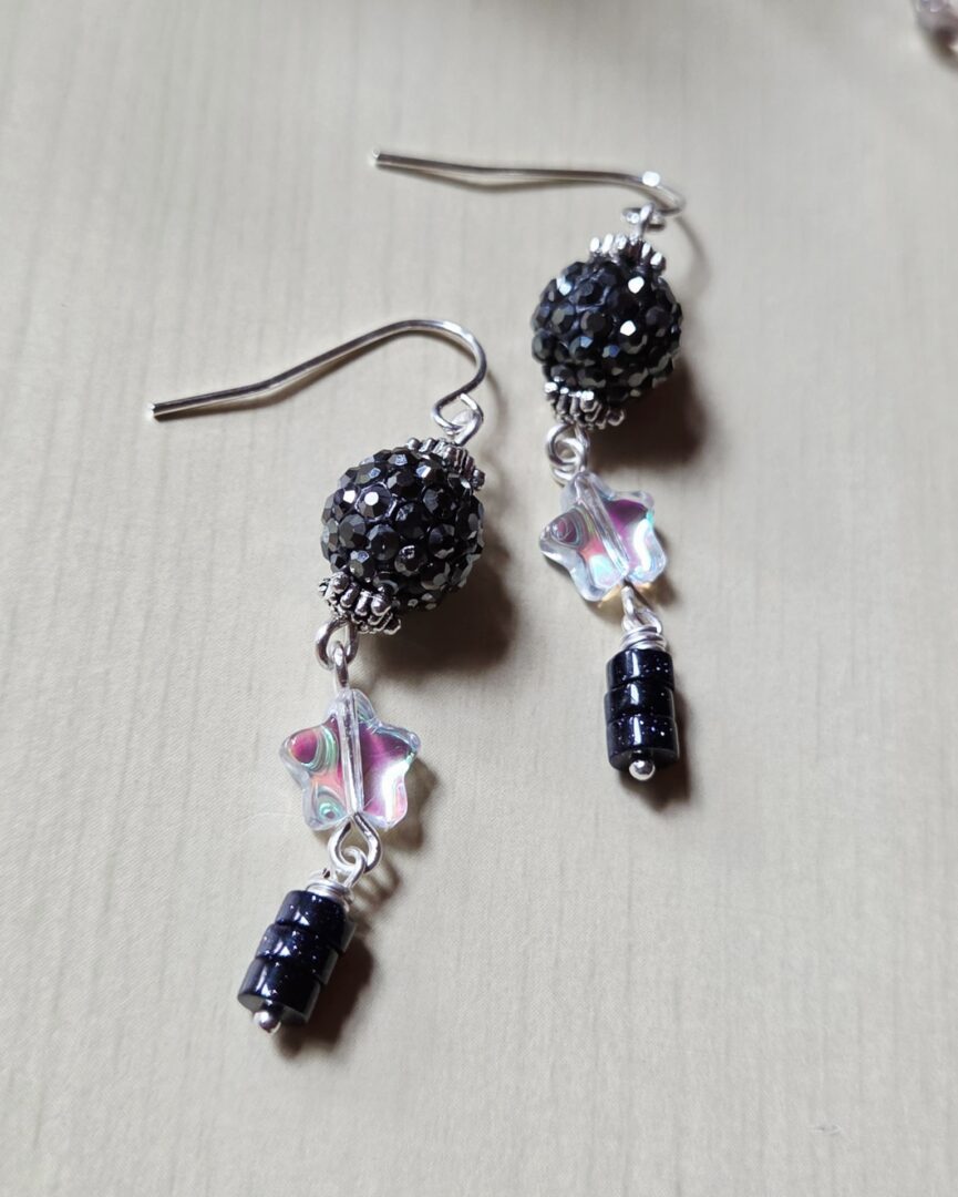 Handmade shimmer star earrings with rhinestone round beads, AB glass stars and stacked blue goldstone heishi disks.